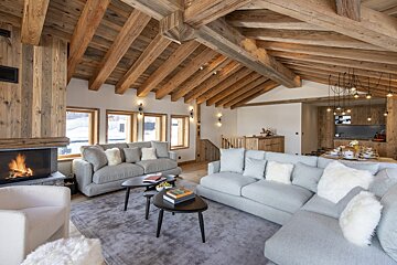 A living room with a couch and a fireplace