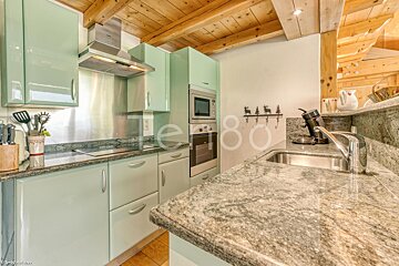 A kitchen with the number 80 on the counter