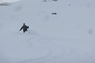 a skier in fresh snow