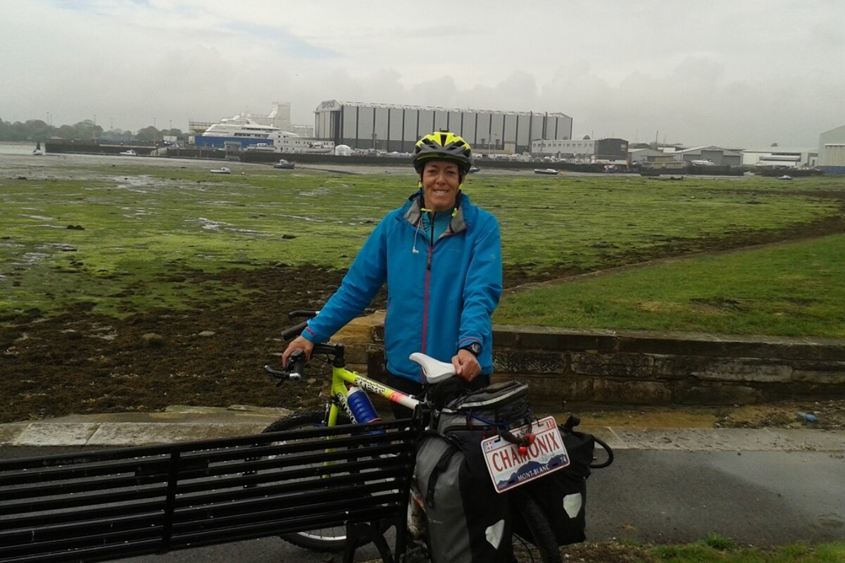 a woman with a bike in a ferry port