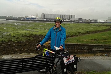 a woman with a bike in a ferry port