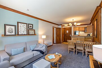 A living room with a couch and a table