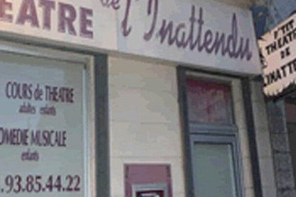 A building with a sign that says theatre on it