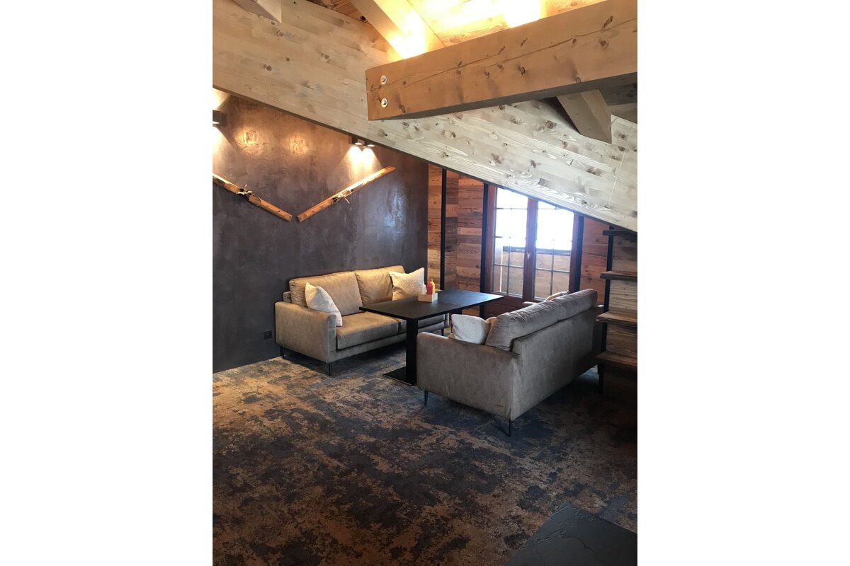 A room with a couch and a table in it