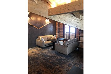 A room with a couch and a table in it