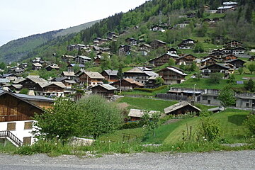 A small village sits on the side of a mountain