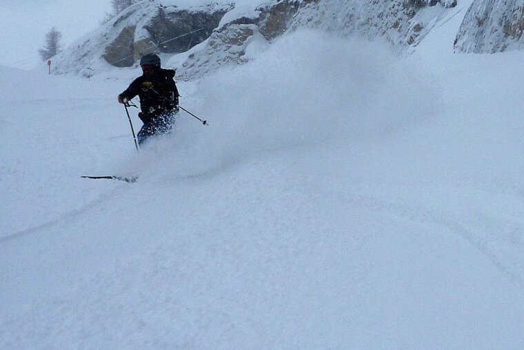 skiing in deep snow on piste