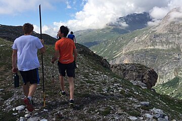 4 people hiking a mountain in val disere