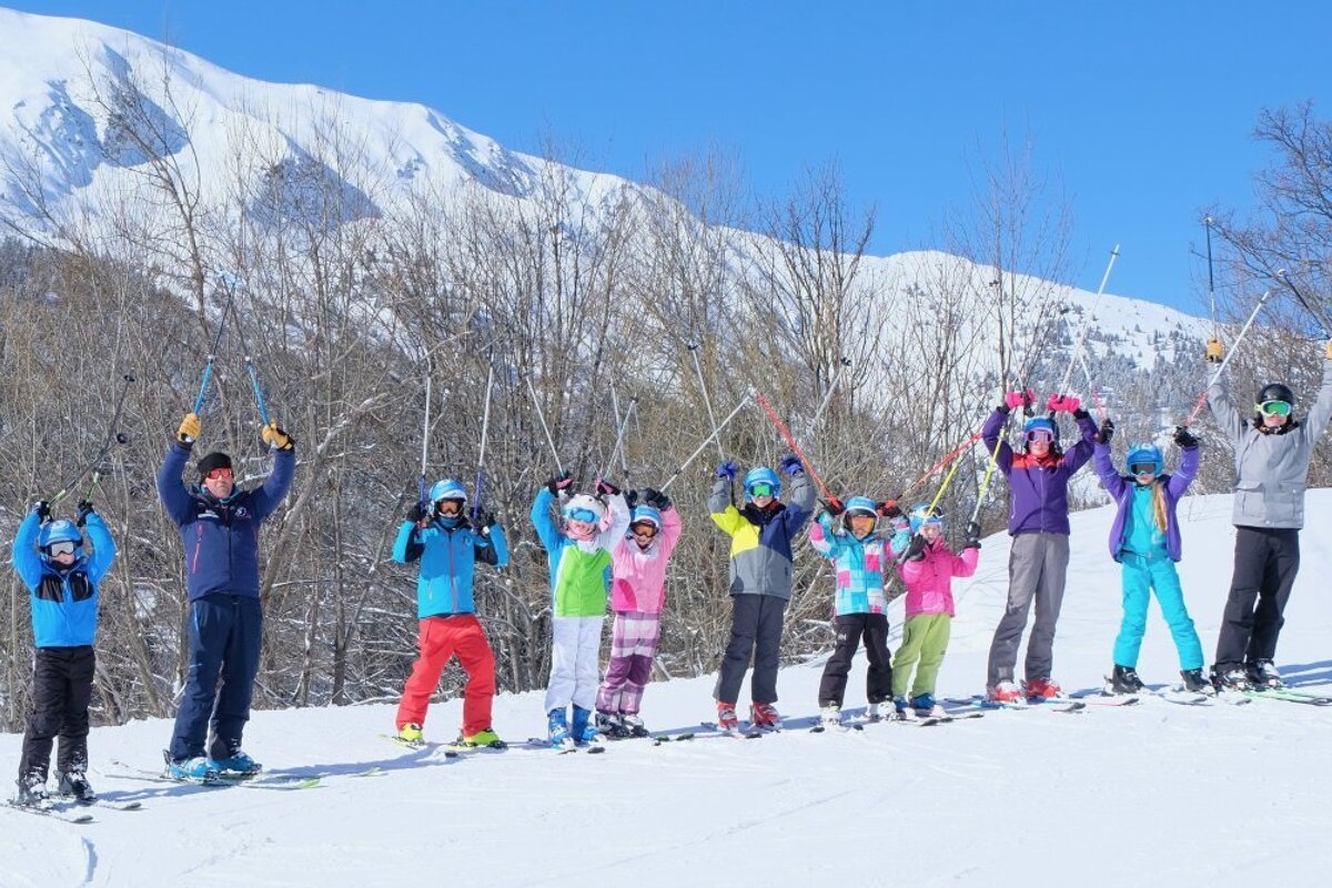 a ski instructor giving a group lesson