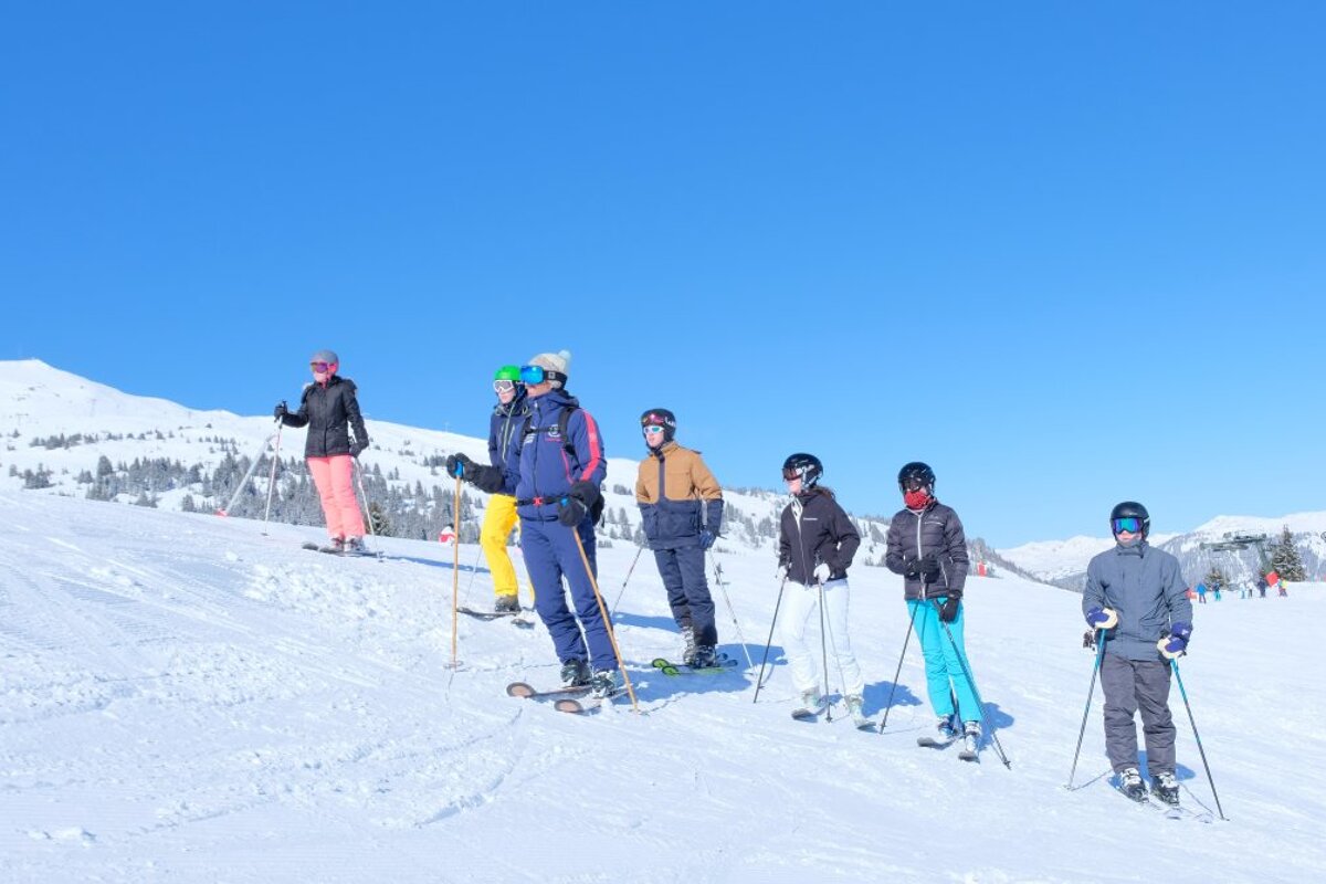a ski instructor giving a group lesson