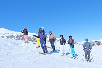a ski instructor giving a group lesson