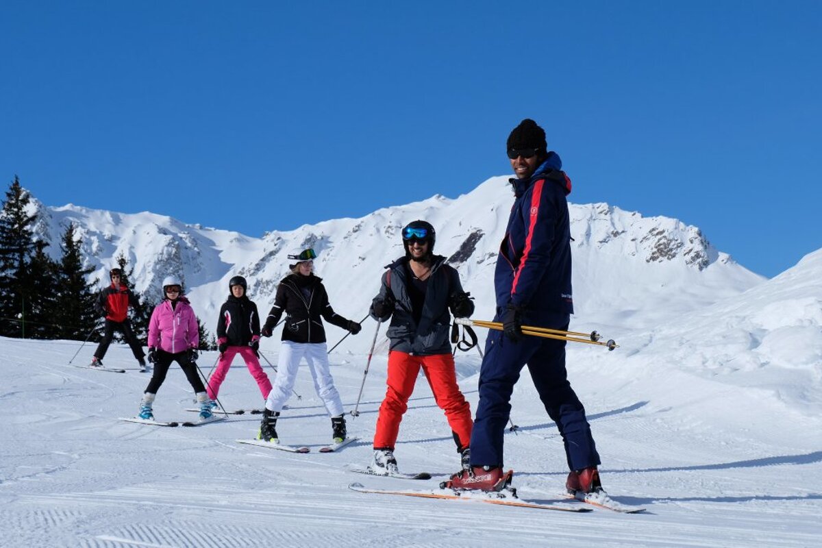 a ski instructor giving a group lesson
