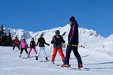 a ski instructor giving a group lesson