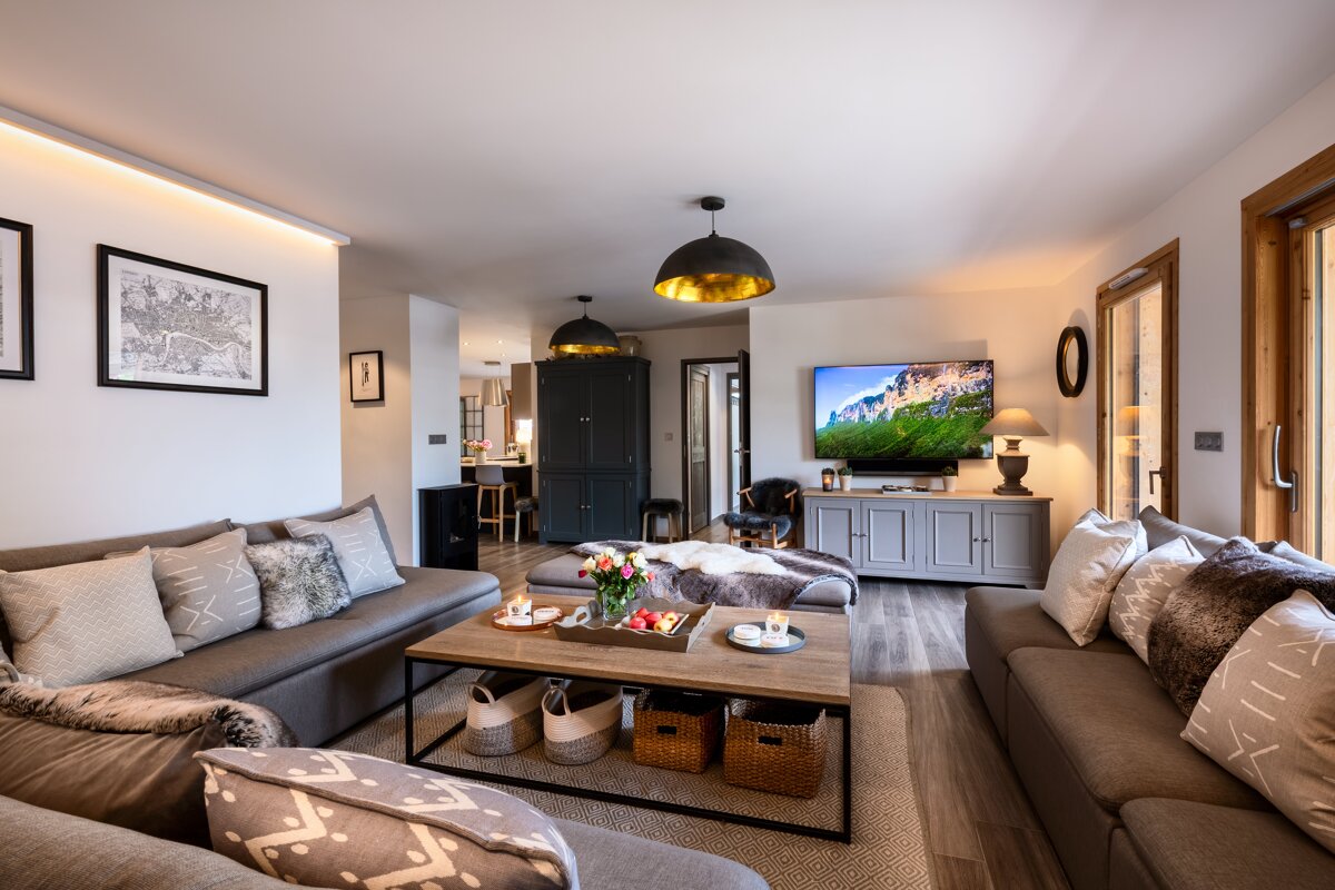 A living room filled with furniture and a flat screen tv