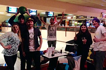 a group of friends at a bowling alley