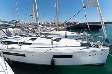 A sailboat with the name free elli on the side