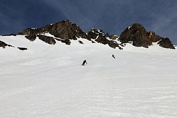 two skiers off piste