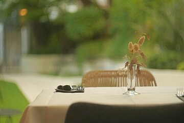 A table with a vase of flowers on it