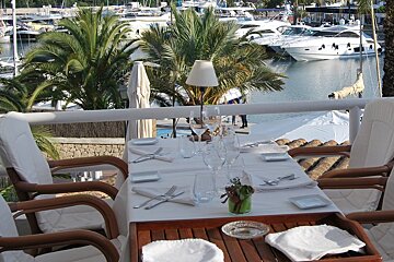 dining table on the terrace at Port Petit