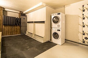 A washer and dryer are stacked on top of each other