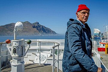 actor as Jacques Cousteau with red hat