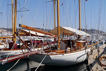 a row of traditional wooden yachts in cannes