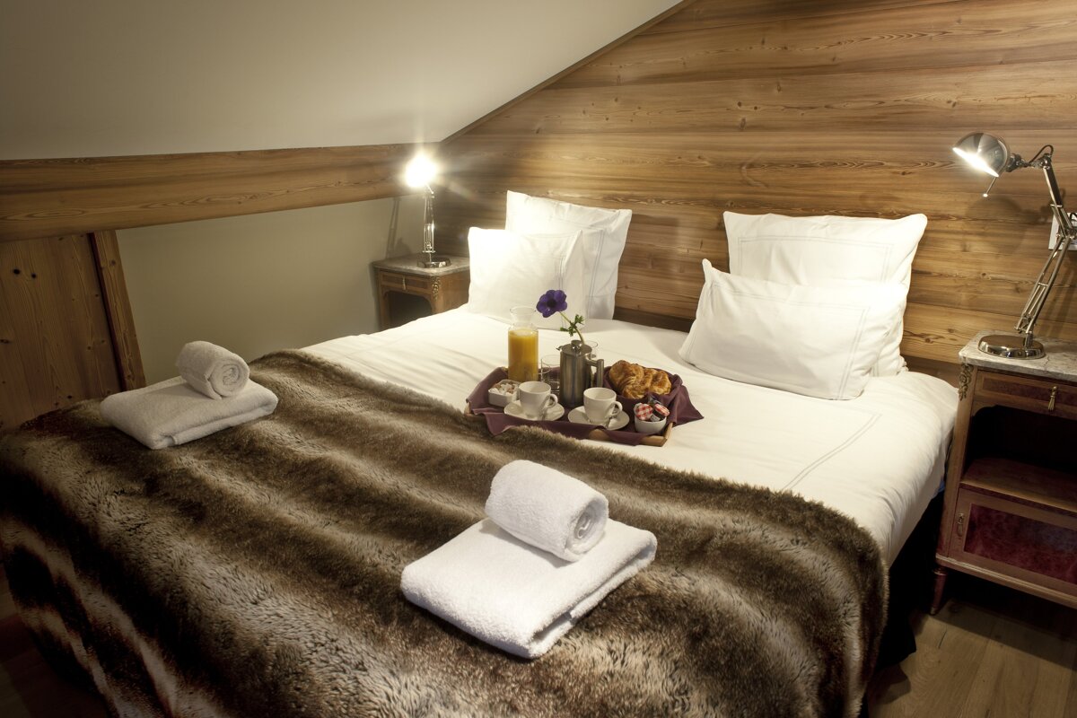 A bed with a tray of food on it