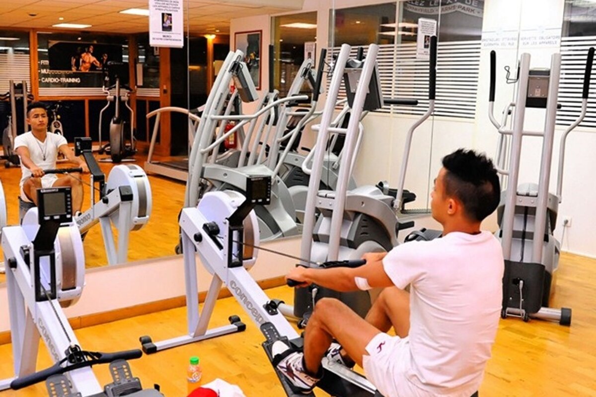 image of a man on a rowing machine at a gym