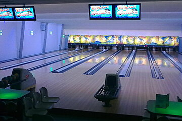 A bowling alley with a sign that says enjoy