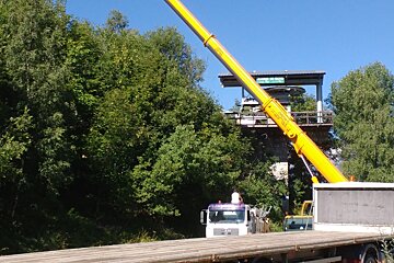 a crane removing a ski lift