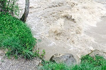 a wild river in morzine in floods