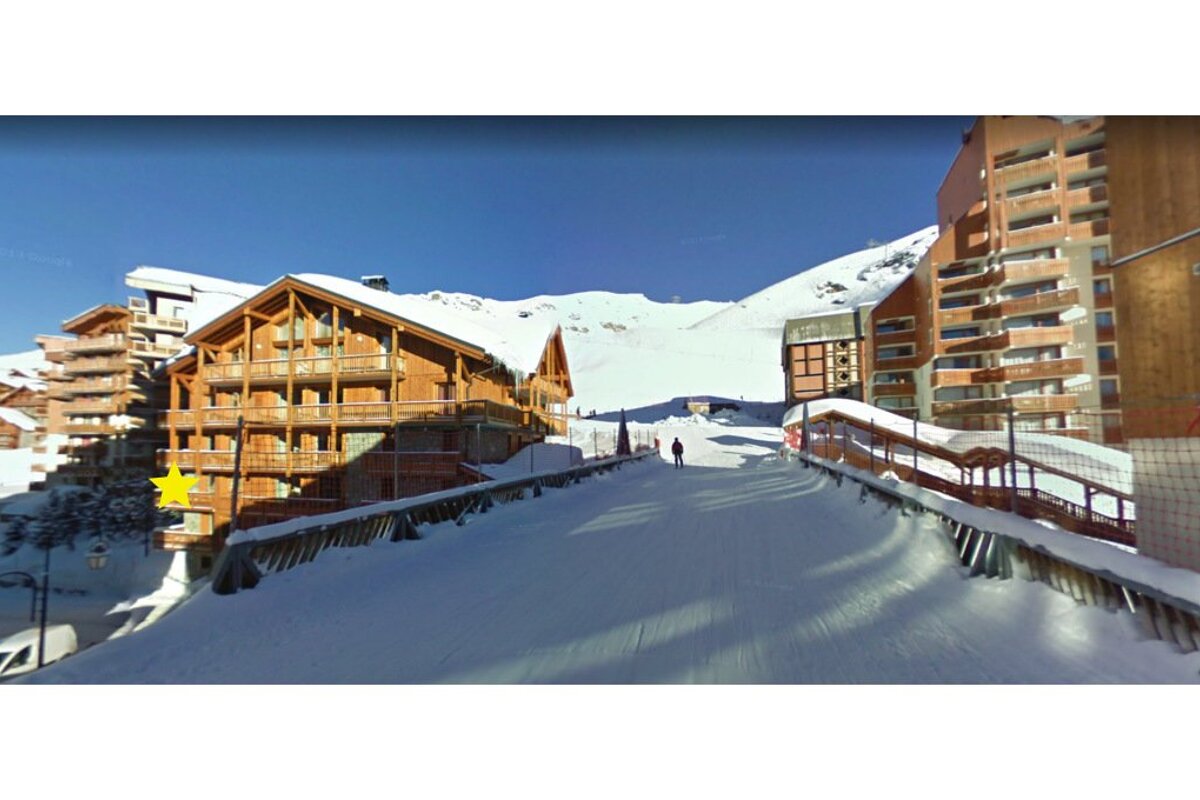 A snowy building with a yellow star on it