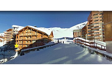 A snowy building with a yellow star on it