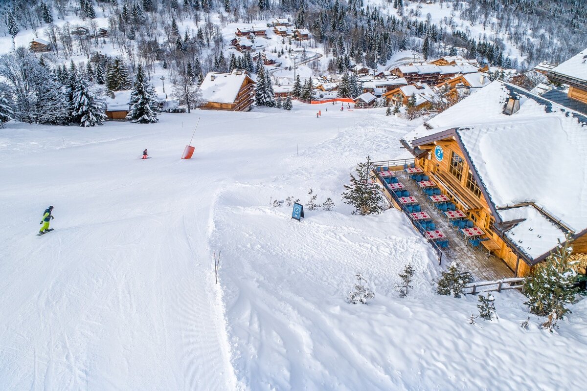 An aerial view of a ski resort with the number 8 on the building