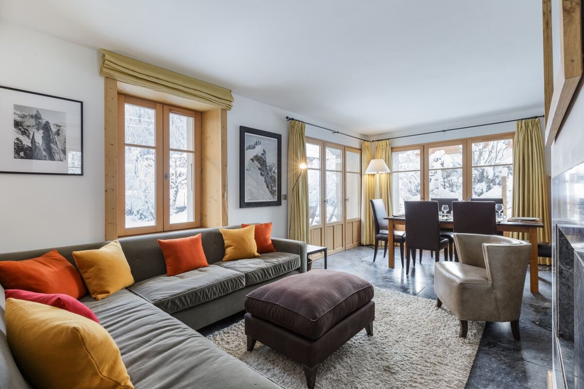 A living room with a couch and a chair