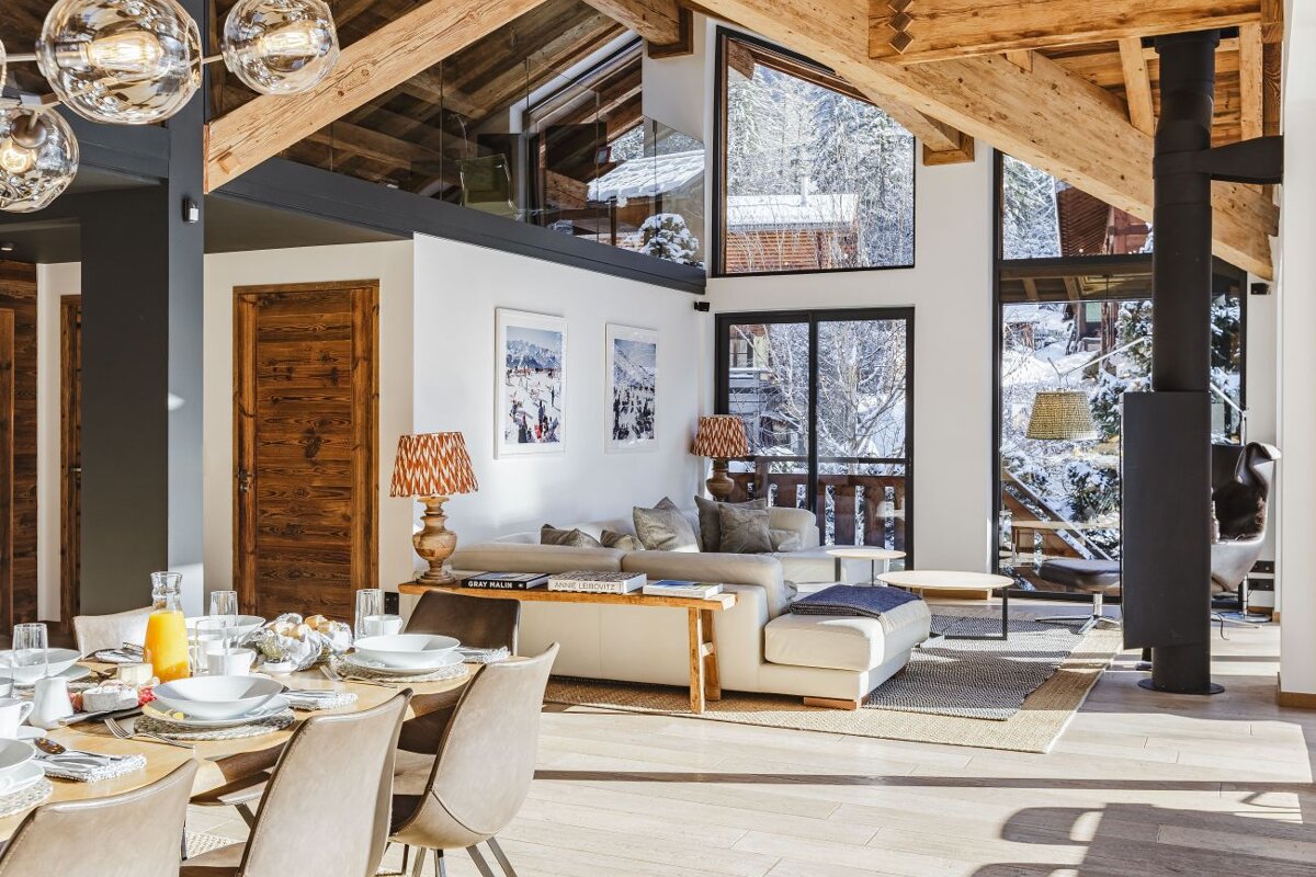 A living room with a couch and a table with plates on it