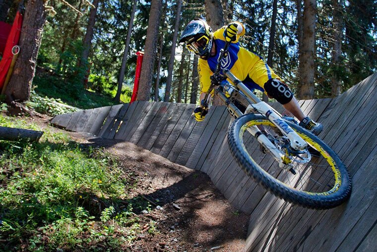 a mountain biker on a wall ride in les arcs