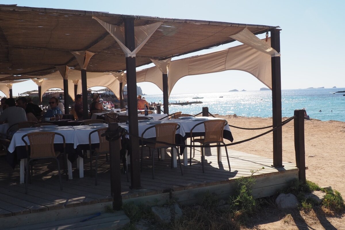 a restaurant on the beach at cala conta west ibiza