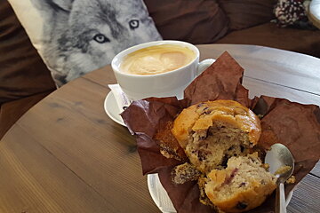a muffin and a cup of coffee