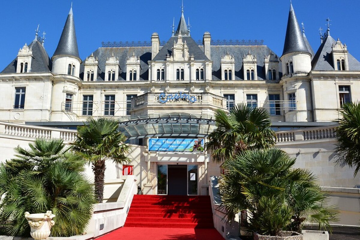 a chateau style building with a red carpet