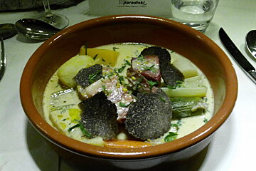 Truffles on top of a stew, cutlery