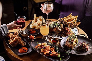 A table with plates of food and drinks on it