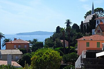 rooftops of Cap d'Ail and a church with a tower