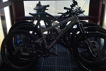 four mountain bikes on a lift in les houches