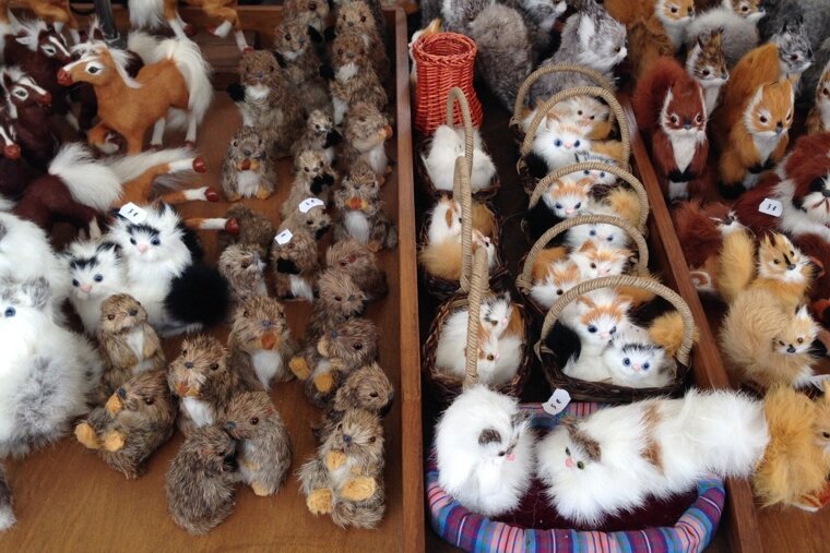 small souvenirs on a table in a market