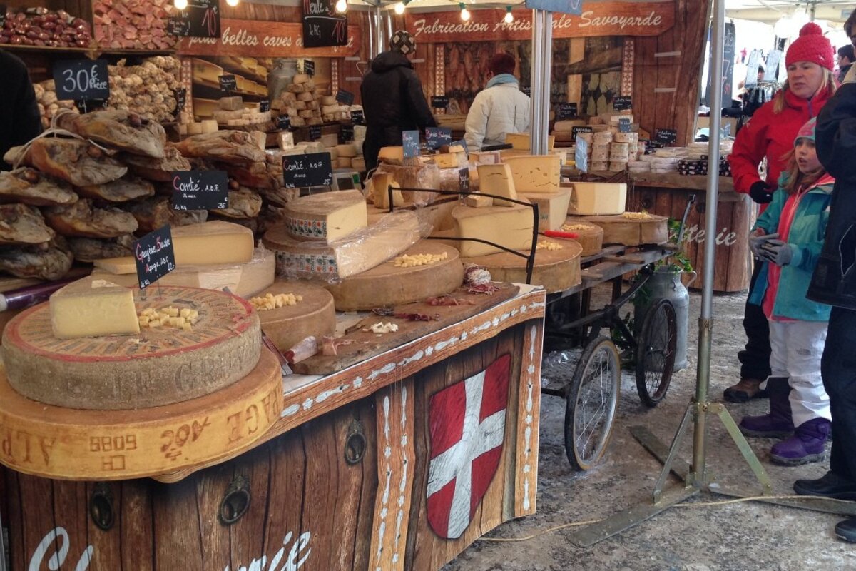 a cheese stand at the local market