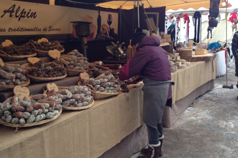 lots of regionally produced sausages on a market stall
