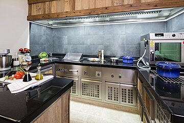 A kitchen with a stainless steel appliance that says zanini