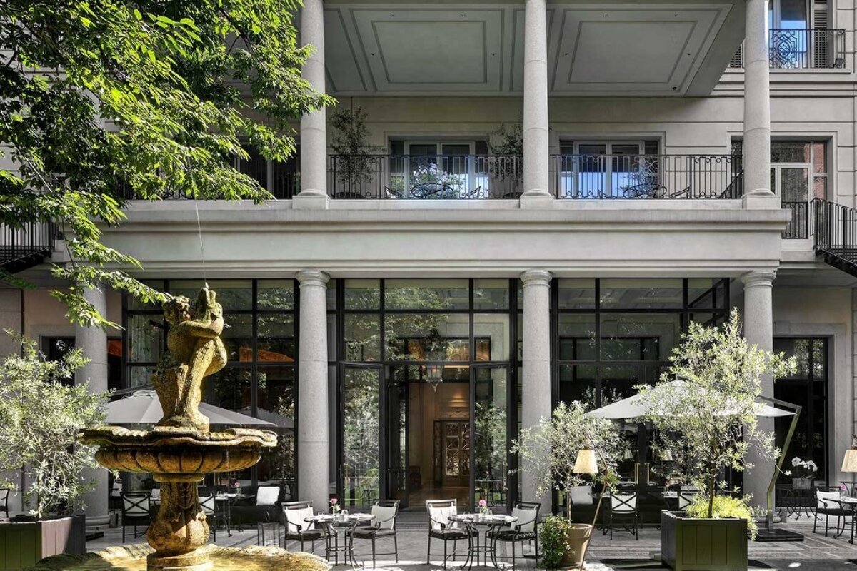 A large building with a fountain in front of it