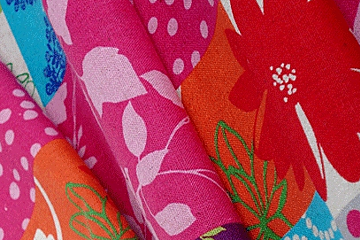 a picture of brightly coloured fabrics with floral prints